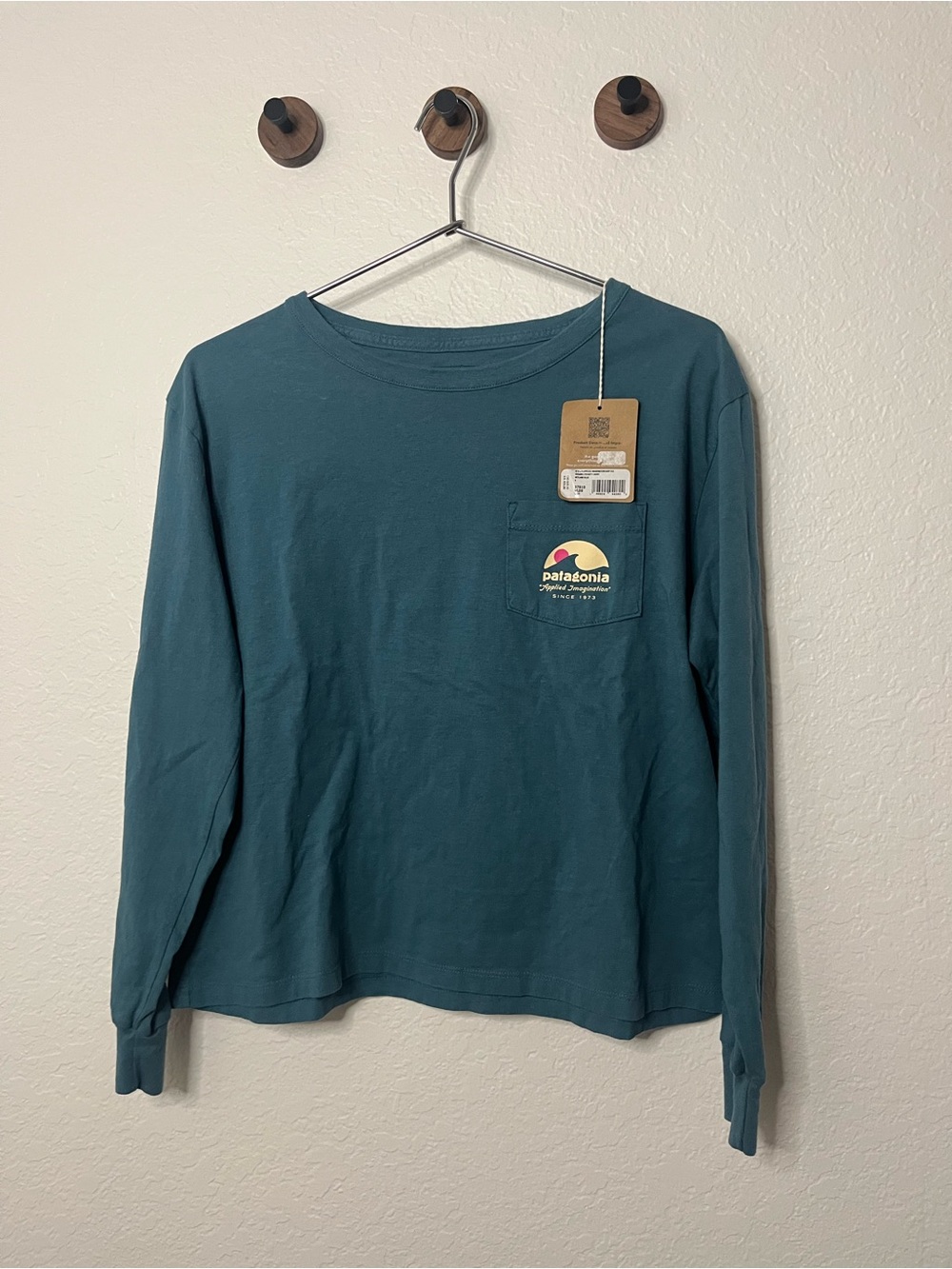Patagonia Teal Long Sleeve Cropped Pocket Tee with Sunrise Logo
